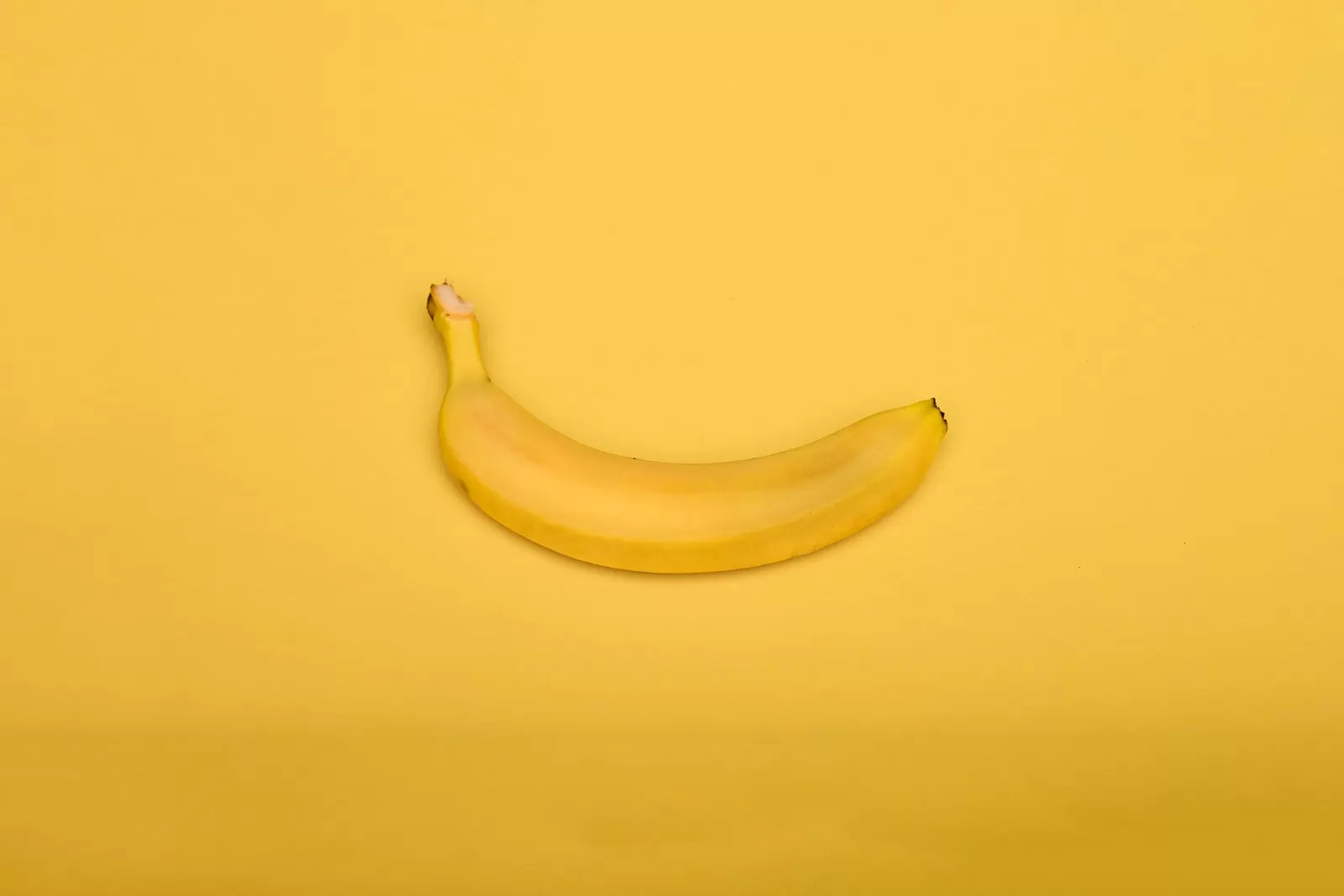 yellow banana on yellow surface